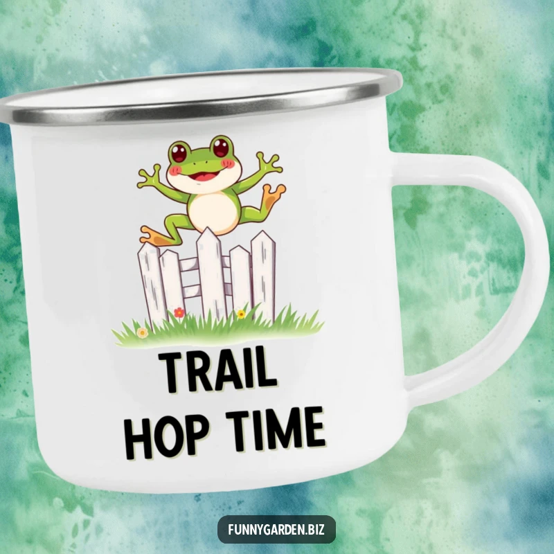 Funny kawaii frog camping mug showing a joyful leap over a miniature, stylized garden fence, perfect for outdoors.