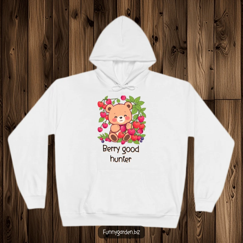 Funny kawaii bear hoodie showing a joyful bear picking glowing berries, radiating humor and warmth. Ideal for gifting.